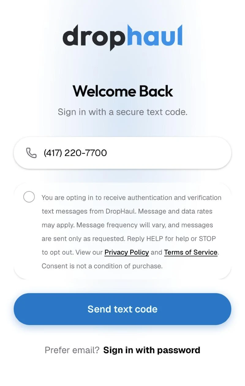 DropHaul phone sign-in screen with a mobile number entered and the unchecked text message consent box above the Send text code button.
